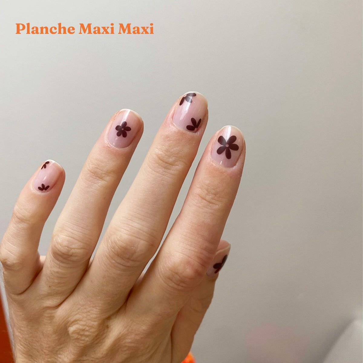 maxi flower nail tattoo