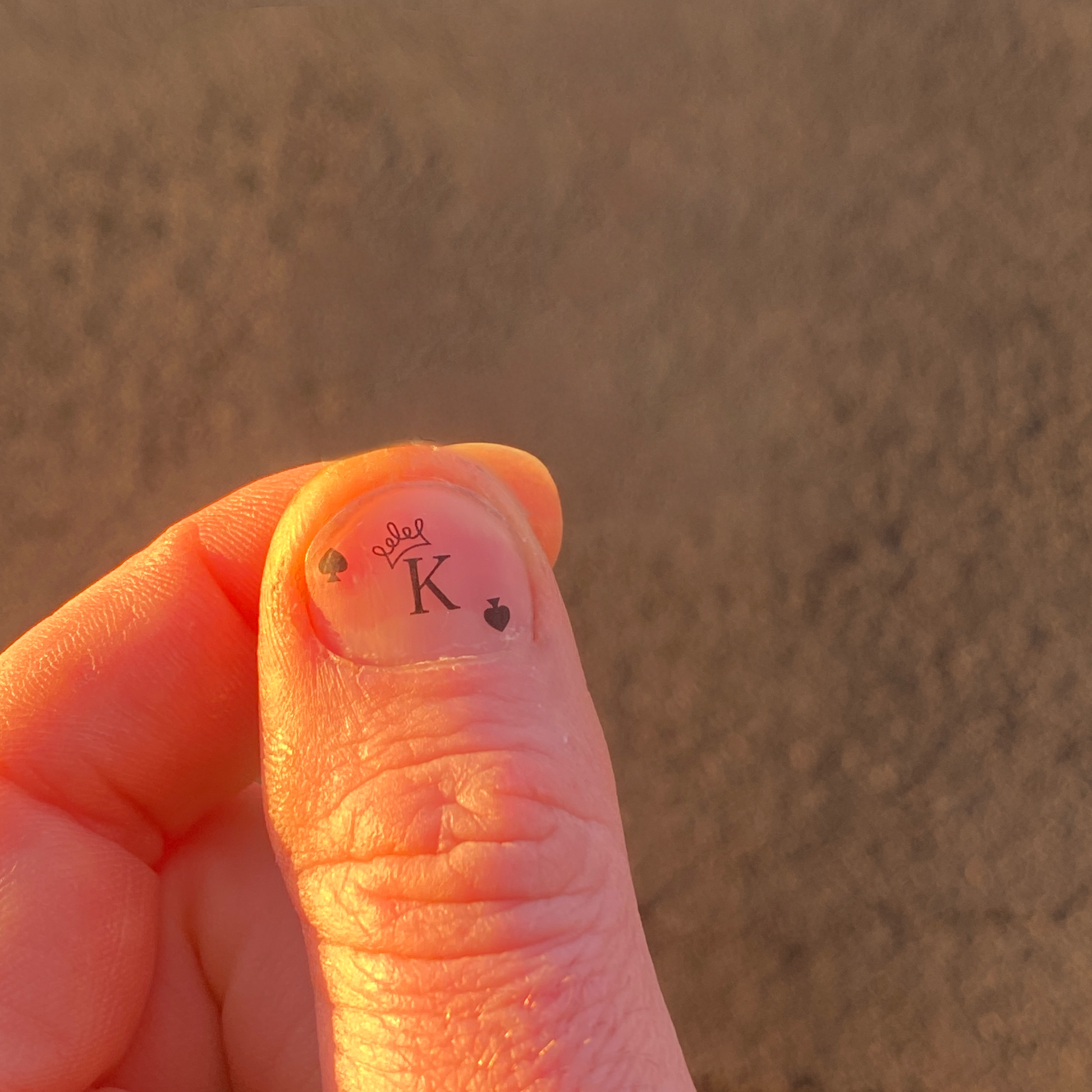 nail tattoo king homme